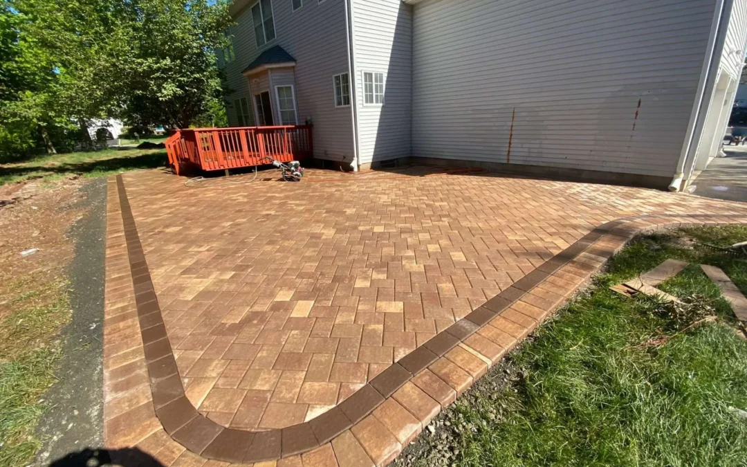 Paving contractors in Randolph NJ laying a new asphalt driveway